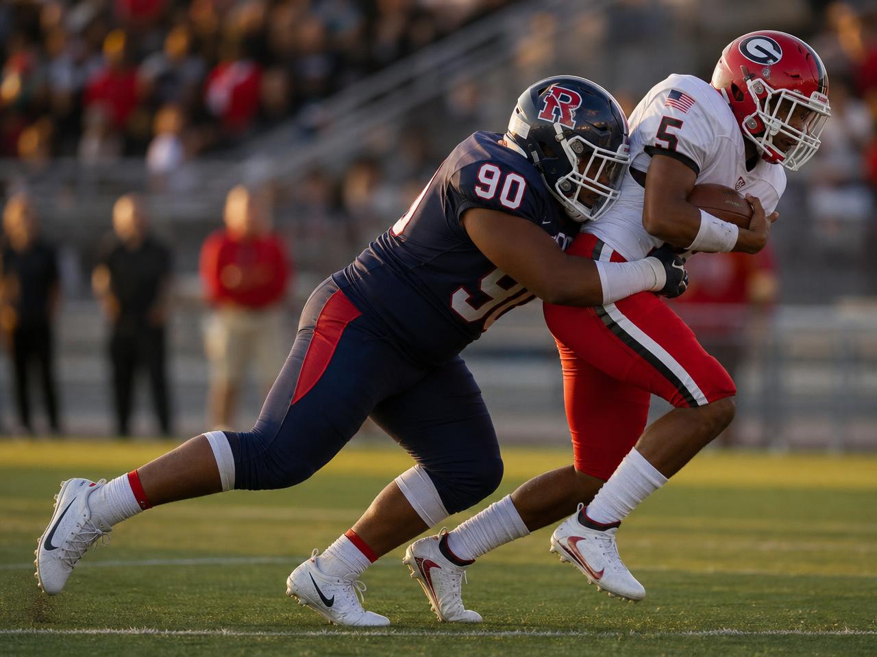 A defensive lineman shedding a block and making a tackle in the backfield