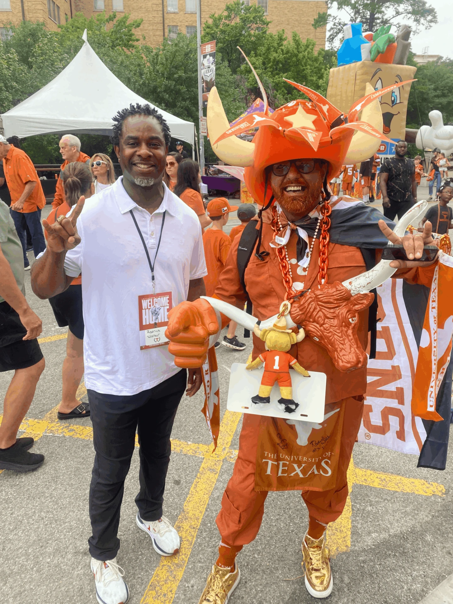 Rodrick Walker greeting fans at a University of Texas game day event