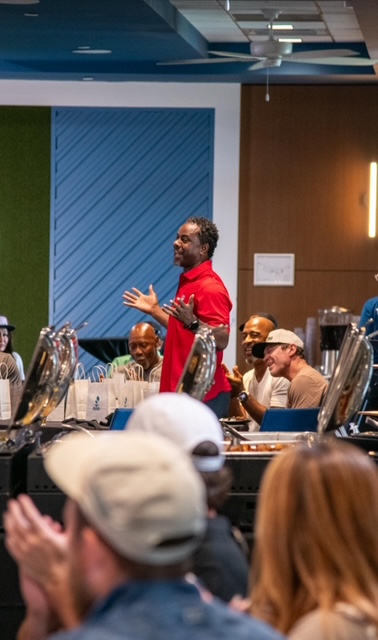 Rodrick Walker speaking to guests at a foundation fundraiser