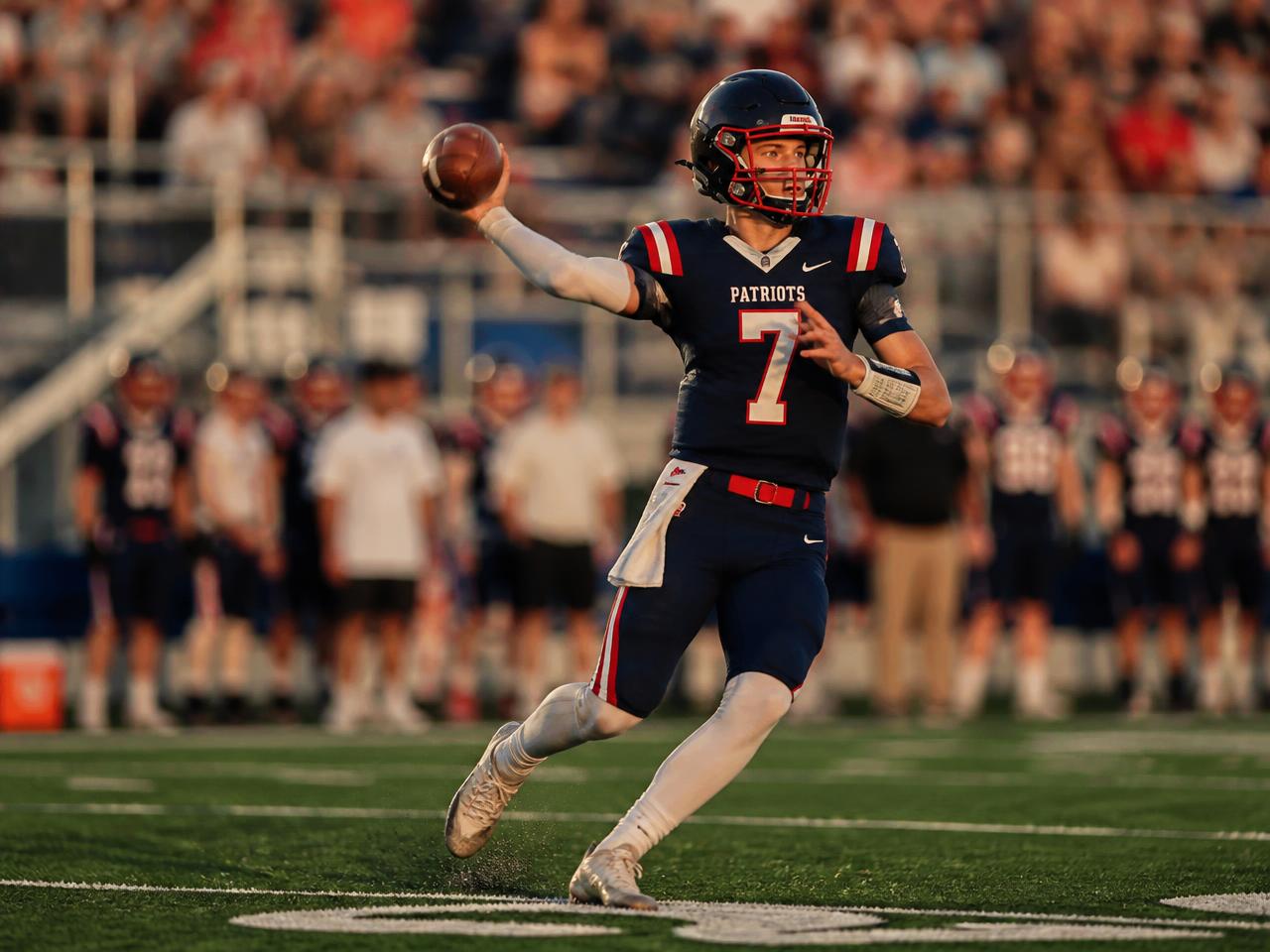 A quarterback throwing accurately while on the run